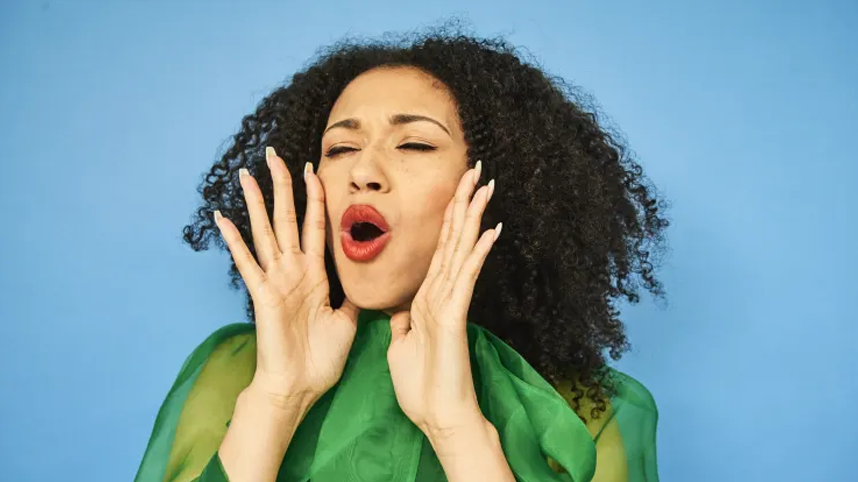 Woman with hands around face