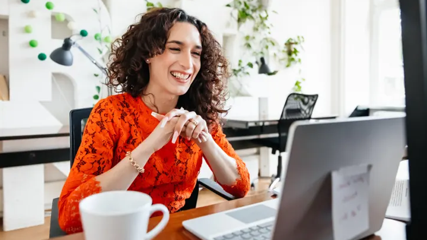 Woman at desk smiling