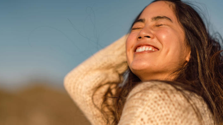 Smiling person looking up