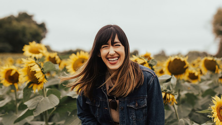 Woman in sunflower field