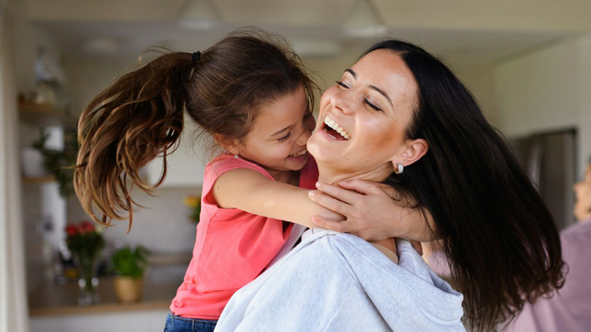 Smiling Mother and Child hugging