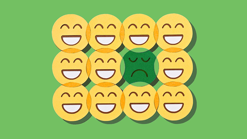 Illustration of smiley faces with one unhappy